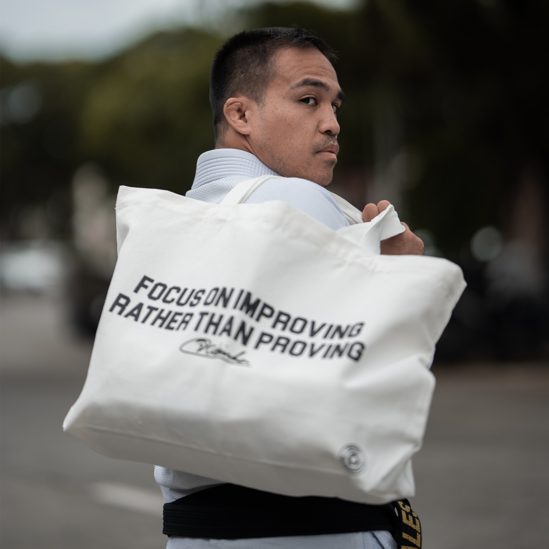 Focus on improving rather than proving Tote Bag