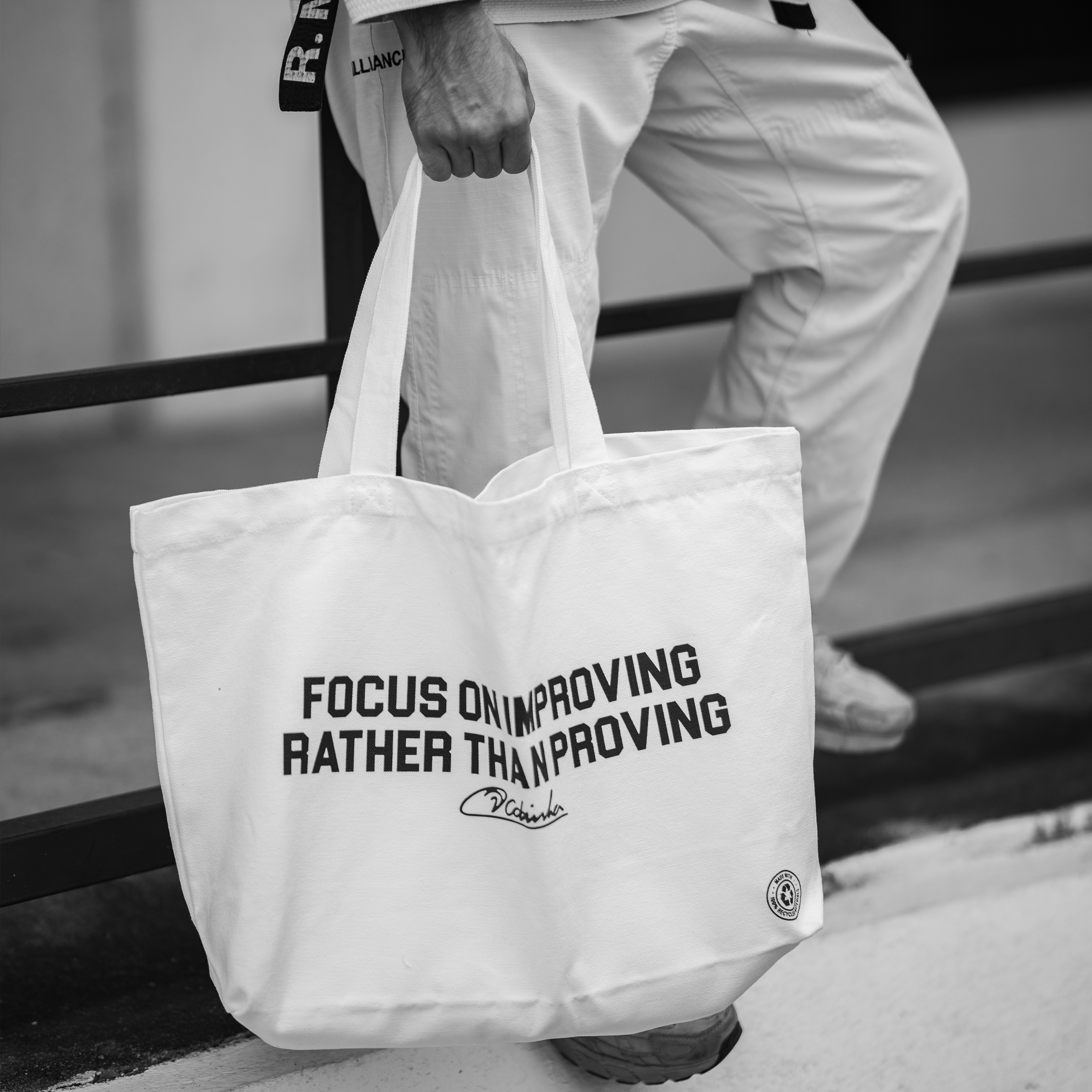Focus on improving rather than proving Tote Bag